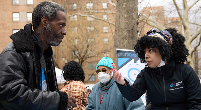 Patient speaking with Mount Sinai staff member